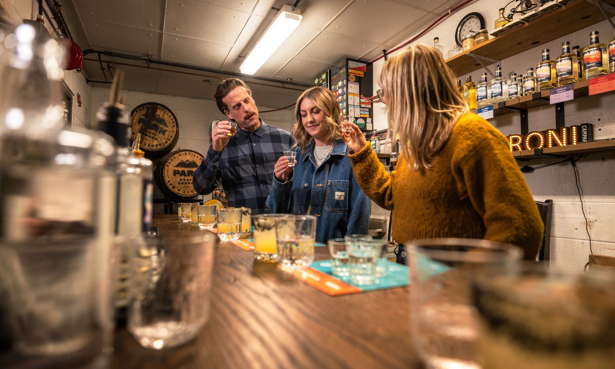 Three people trying gin during the Blend your Own Gin experience at PARK Distillery.